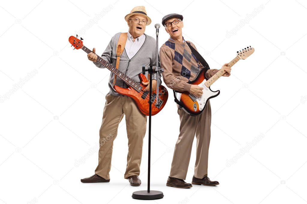 Two elderly gentlemen playing guitars and singing on a microphon