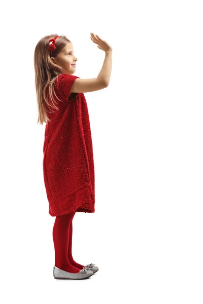 Niña en un vestido rojo saludo con la mano — Foto de Stock