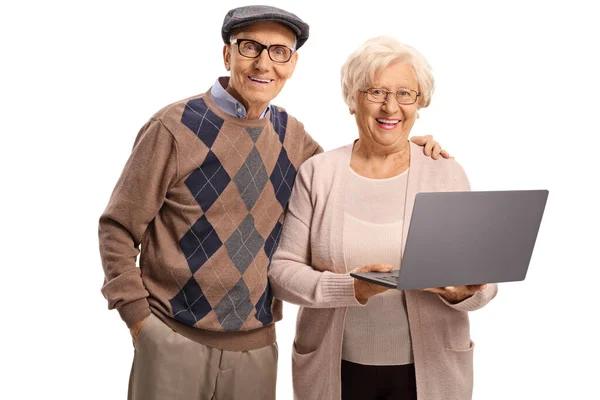 Happy elderly man and woman with a laptop — Stock Photo, Image