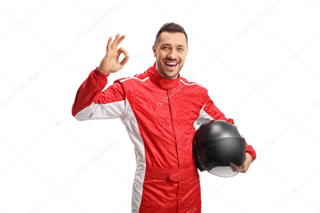 Male racer holding a helmet and gesturing with hand