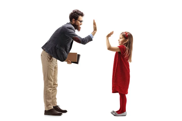 Bearded man holding books and gesturing high-five with a little — Stock Photo, Image