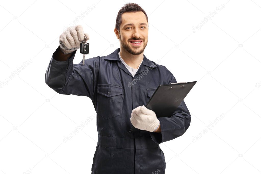 Auto mechanic with a car key and a clibboard