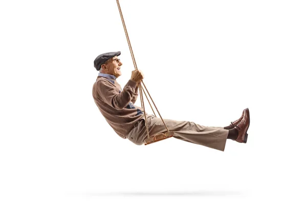 Senior gentleman swingin on a wooden swing — Stock Photo, Image