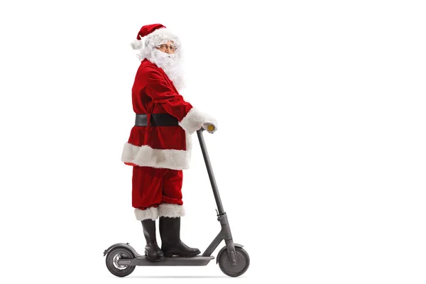 Elektrikli scooter kullanan Noel Baba. — Stok fotoğraf