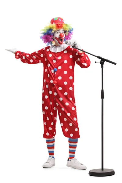 Fuunny clown met een microfoon — Stockfoto