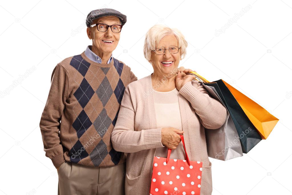 Elderly couple with shopping bags