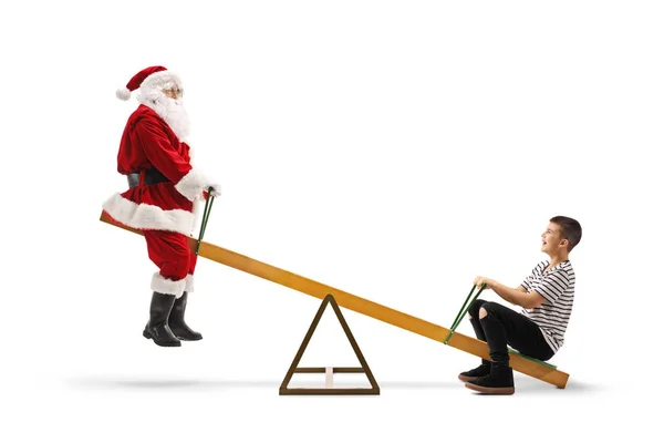 Babbo Natale su un'altalena con un ragazzo adolescente felice — Foto Stock