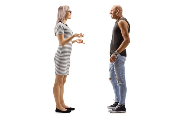 Woman talking to a bald male hipster — Stock Photo, Image