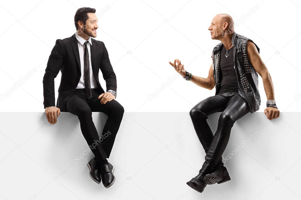 Punker and a businessman sitting on a panel and having a convers