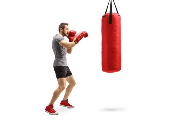 Young athlete training box with a punching bag