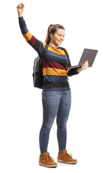 Female student holding a laptop and gesturing happiness with rai — Stock Photo, Image