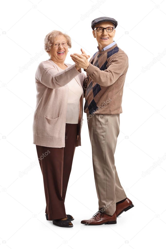 Casual elderly man and woman dancing tango