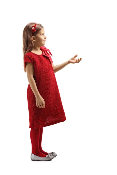 Little girl in a red dress holding her hand front and waiting — Stock Photo, Image