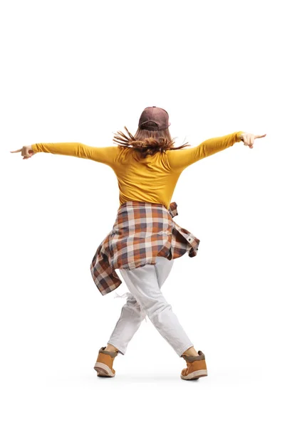 Achteraanzicht shot van een jonge vrouw in casual kleding dansen — Stockfoto