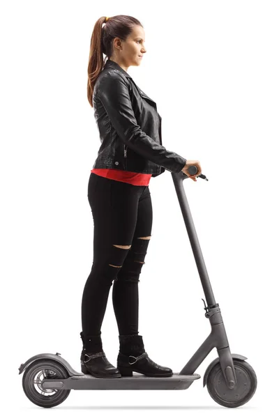 Joven mujer de moda montando un scooter eléctrico —  Fotos de Stock