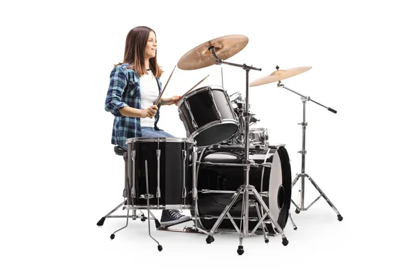 Young female drummer playing a drum set — Stock Photo, Image