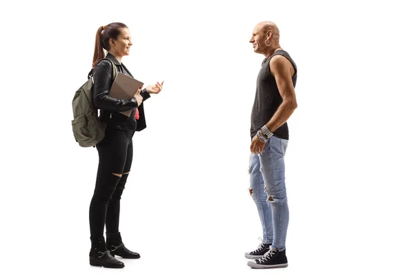 Male hipster and a female student holding books and having a con — Stock Photo, Image