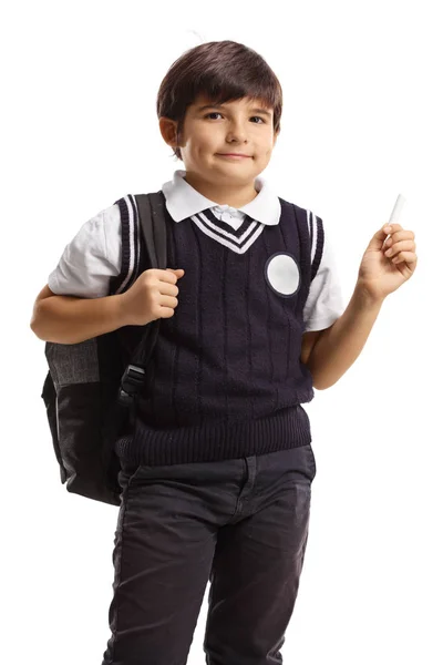 Colegial en uniforme sosteniendo una tiza — Foto de Stock