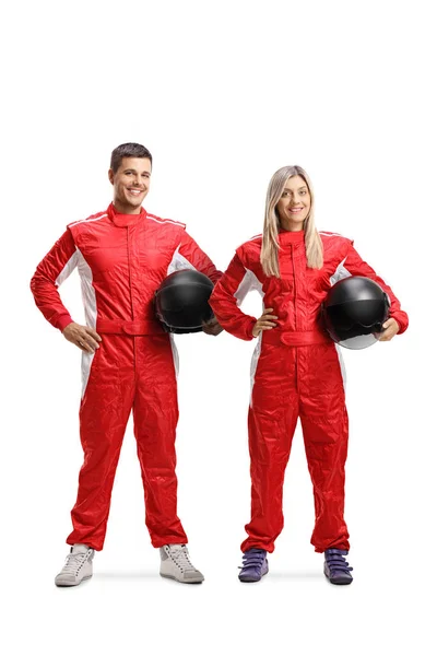 Team of a male and female car racers holding helmet — Stock Photo, Image