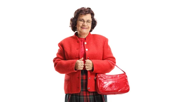 Starsza pani z czerwoną torebką — Zdjęcie stockowe