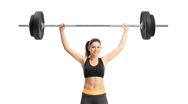 Young woman lifting a barbell — Stock Photo, Image
