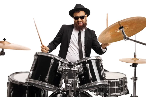 Man in a suit playing drums — Stock Photo, Image