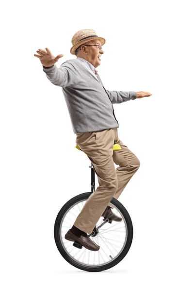 Starší muž na jednokolce — Stock fotografie