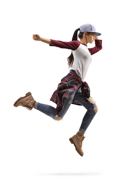 Young woman in casual clothes performing a jump — 스톡 사진