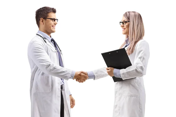 Male and female doctor shaking hands — Stock Photo, Image