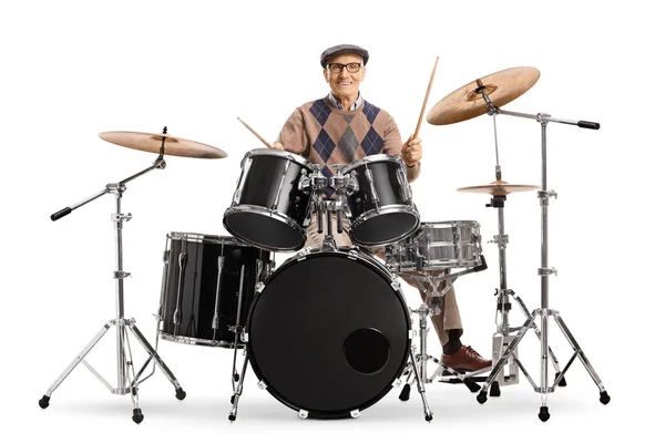Hombre mayor tocando en un kit de batería —  Fotos de Stock