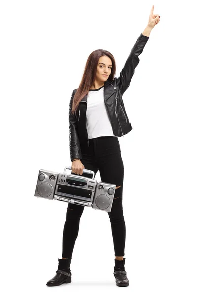 Young woman holding a boombox radio and raising one hand — Stock Photo, Image