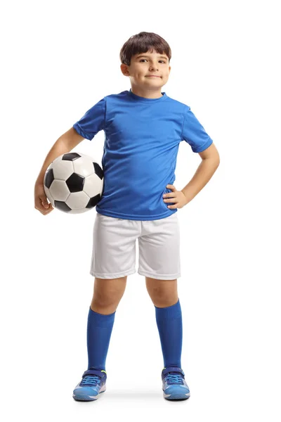 Boy in sports jersey holding a soccer ball and posing — ストック写真