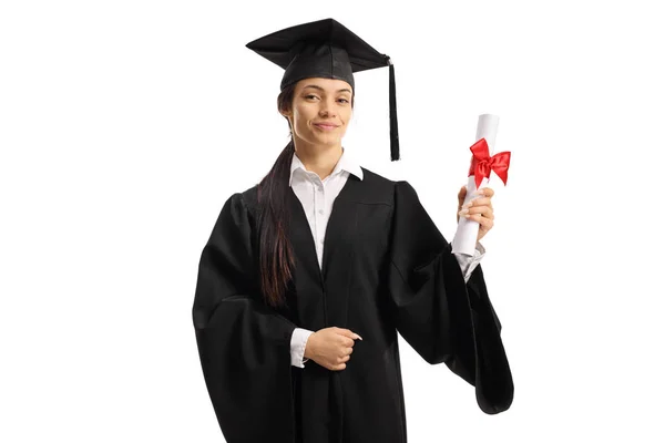 Young woman in a graduation gown holding a diploma — Stock Photo, Image