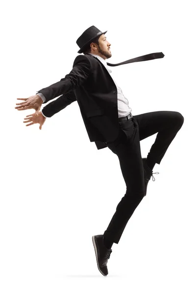Male dancer in a black suit and hat dancing — Stock Photo, Image