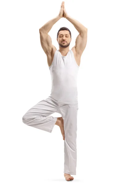 Man in white clothes standing in a meditation pose — 스톡 사진