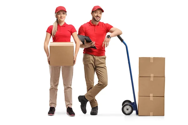 Levering man en vrouw met dozen en een handtruck — Stockfoto