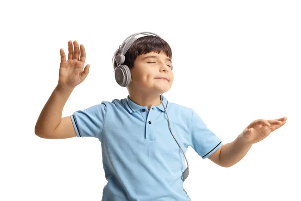 Cute little boy dancing with closed eyes and listening to music — 스톡 사진