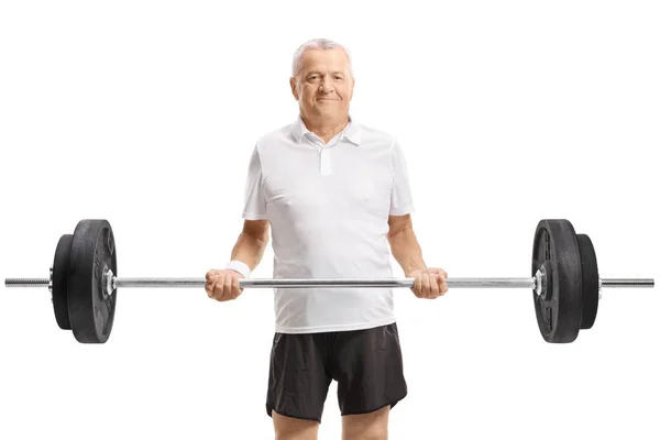 Mature active man lifting a barbell — Stock Photo, Image