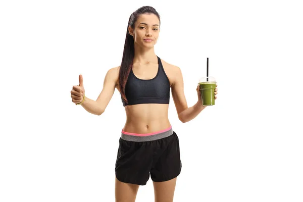 Sportowa młoda kobieta w odzieży sportowej z zielonym smoothie i s — Zdjęcie stockowe