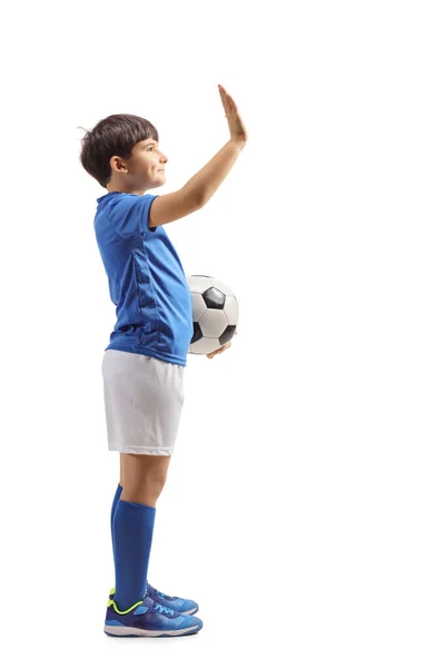 Football boy with a soccer ball gesturing high five — Stock Photo, Image
