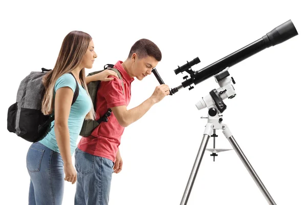 Students looking through a telescope — 图库照片
