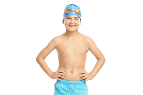 Boy with a blue swim cap and swimming goggles looking at the cam — Stok fotoğraf