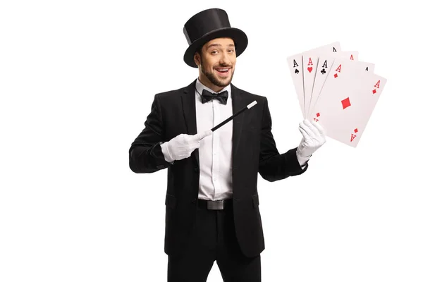 Cheerful magician with a magic wand and 4 aces — 스톡 사진