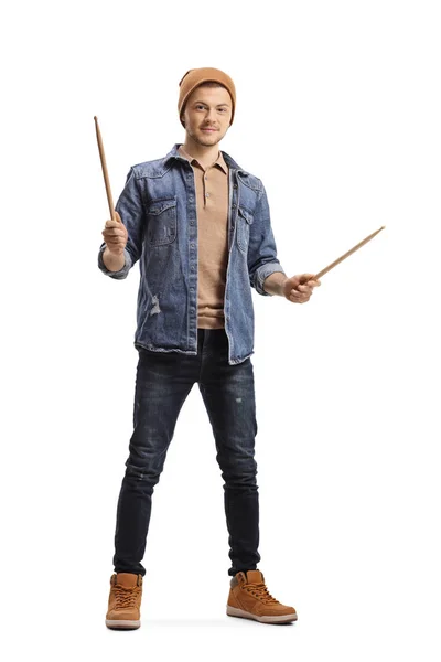 Young male musician holding drumsticks — Stock Photo, Image