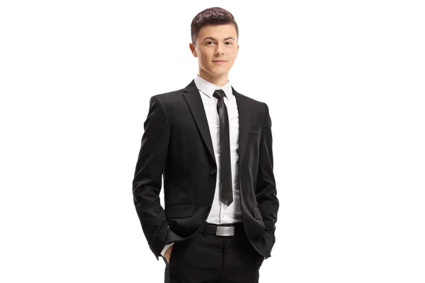 Young man in a suit posing with his hands in pocket — Stock Photo, Image