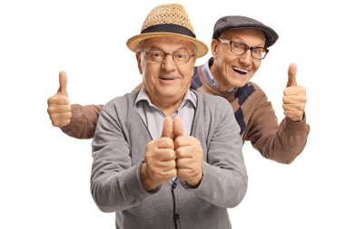 Two happy elderly men showing thumb up gestures 