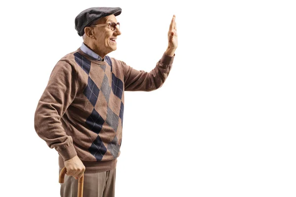 Profile shot of an elderly man gesturing high-five — Stock Photo, Image