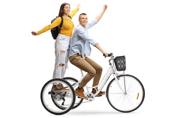 Feliz joven macho y hembra en un triciclo —  Fotos de Stock
