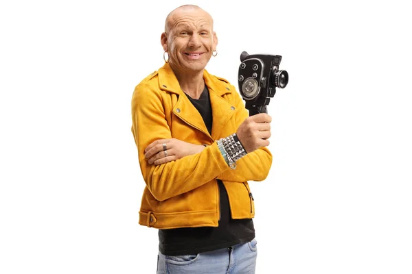 Glatzköpfiger Mann in gelber Jacke lächelt und hält einen Jahrgangsrekord — Stockfoto