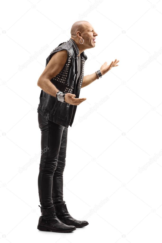 Angry punk in leather clothes gesturing with hands